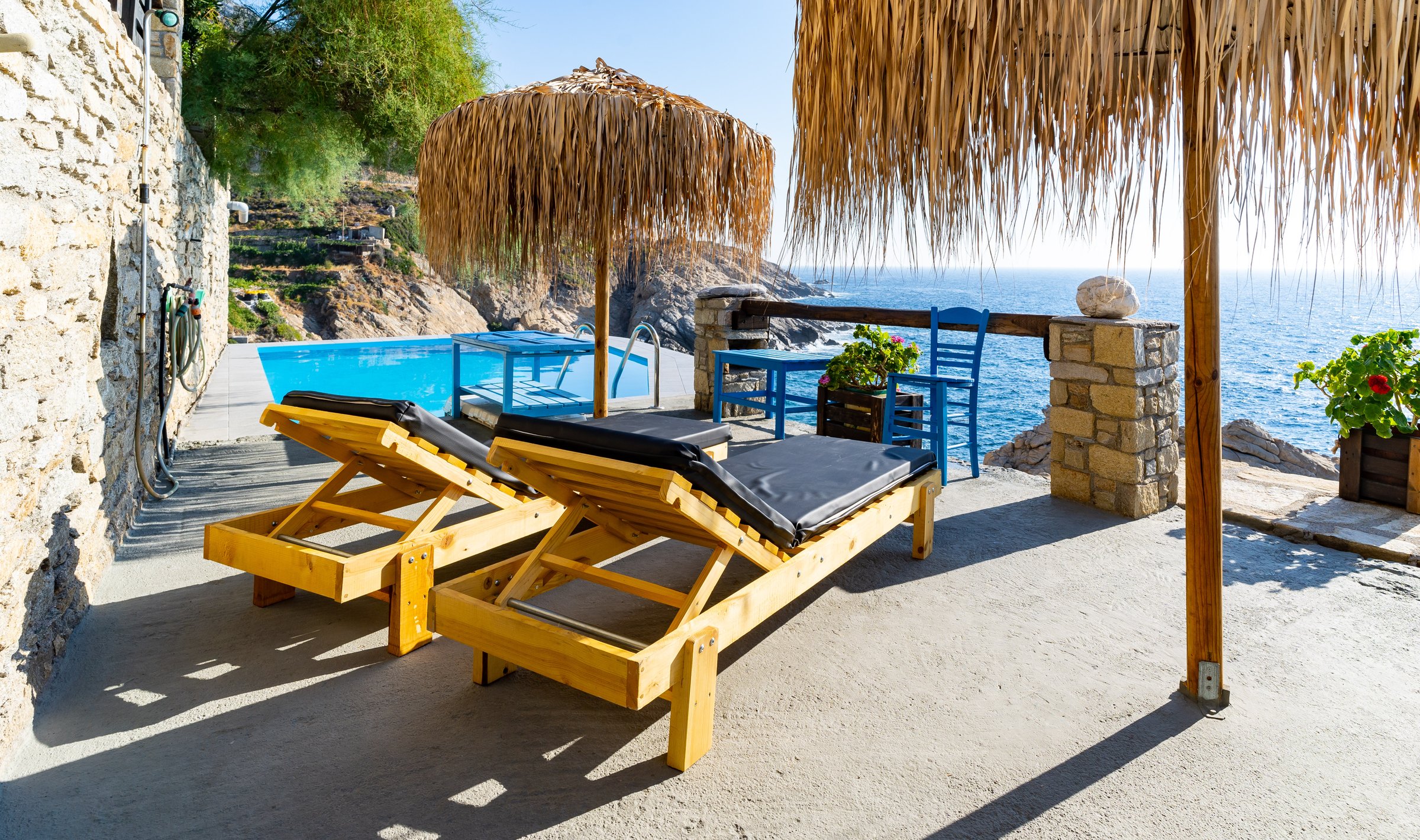 Pool and architecture overlooking the Aegean coastline